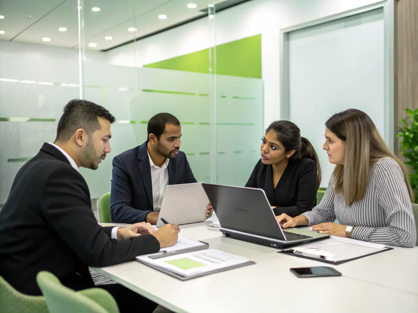 A photograph of a diverse group of business professionals collaborating in a modern office space, symbolizing teamwork and strategic planning.